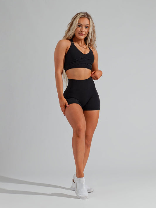 Model wearing Buffbunny matching black workout set, including Legacy Short 4"